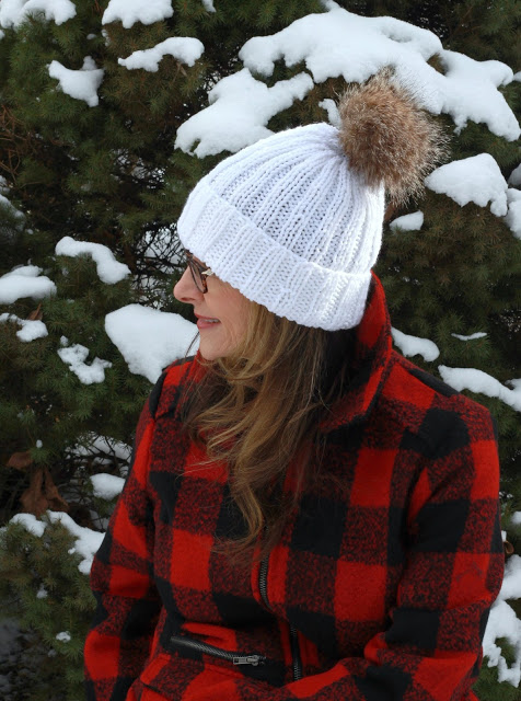 Keep warm with these stylish knitted hats and messy bun with links to easy patterns. Make your own faux fur pompom with easy tutorial.