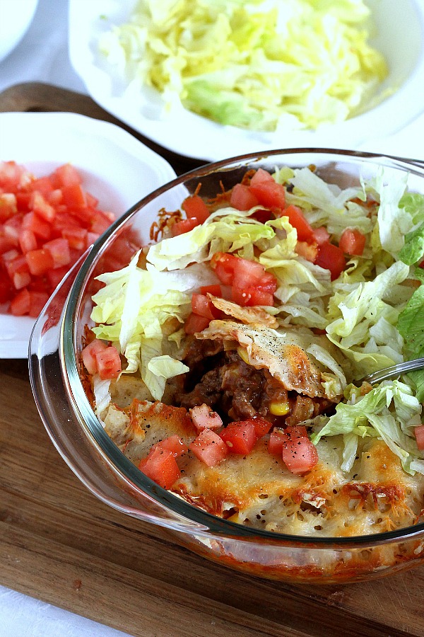 Beef nacho casserole is loaded with meat, corn, salsa, cheese, tortilla chips and spices for great tasting dinner everyone will love!