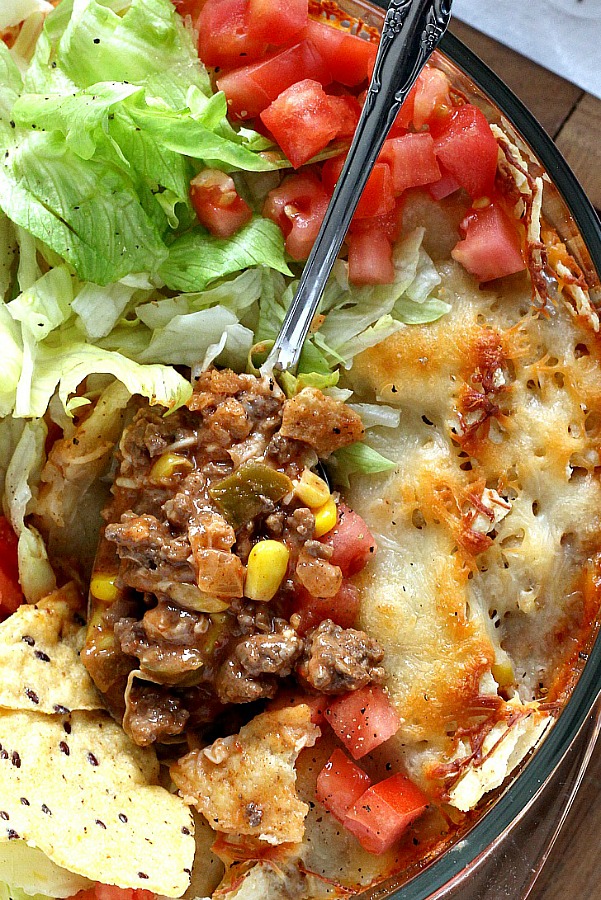 Beef nacho casserole is loaded with meat, corn, salsa, cheese, tortilla chips and spices for great tasting dinner everyone will love!