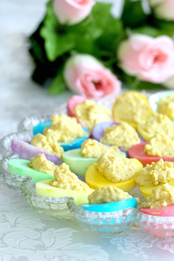 Bring springtime to your Easter table with a palate of soft pastel colored deviled eggs that are almost too pretty to eat. Instead of dying the egg shells, the cooked white part of the egg is colored then filled with the yolk mixture just like regular deviled eggs.