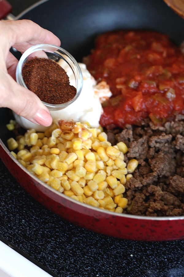 Beef nacho casserole is loaded with meat, corn, salsa, cheese, tortilla chips and spices for great tasting dinner everyone will love!