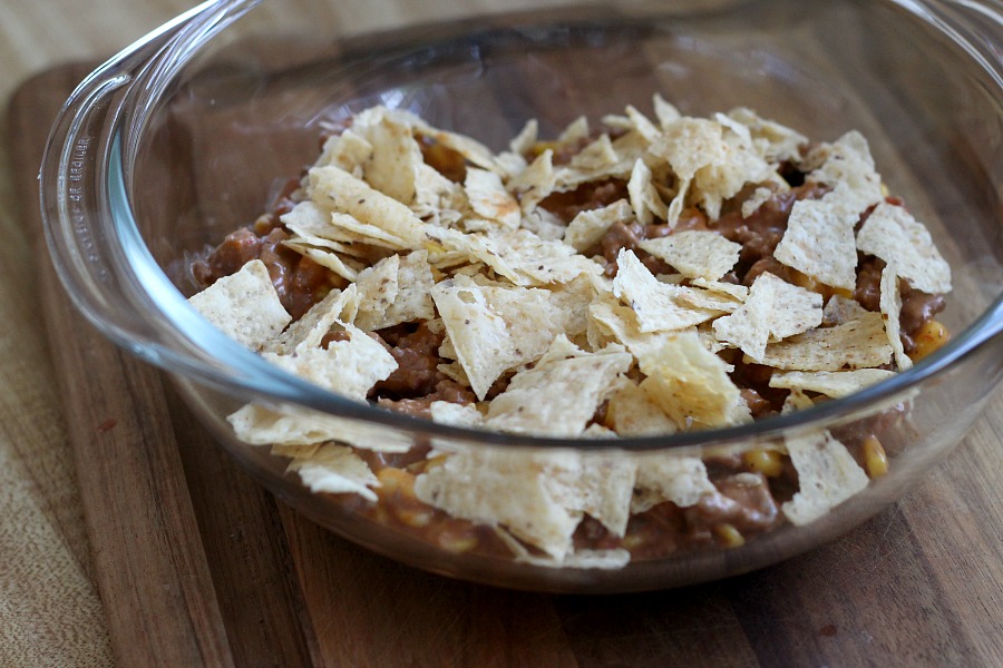 Beef nacho casserole is loaded with meat, corn, salsa, cheese, tortilla chips and spices for great tasting dinner everyone will love!