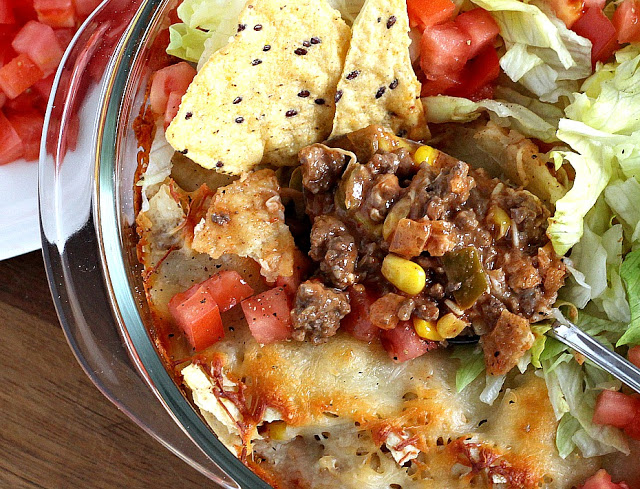 Beef nacho casserole is loaded with meat, corn, salsa, cheese, tortilla chips and spices for great tasting dinner everyone will love!