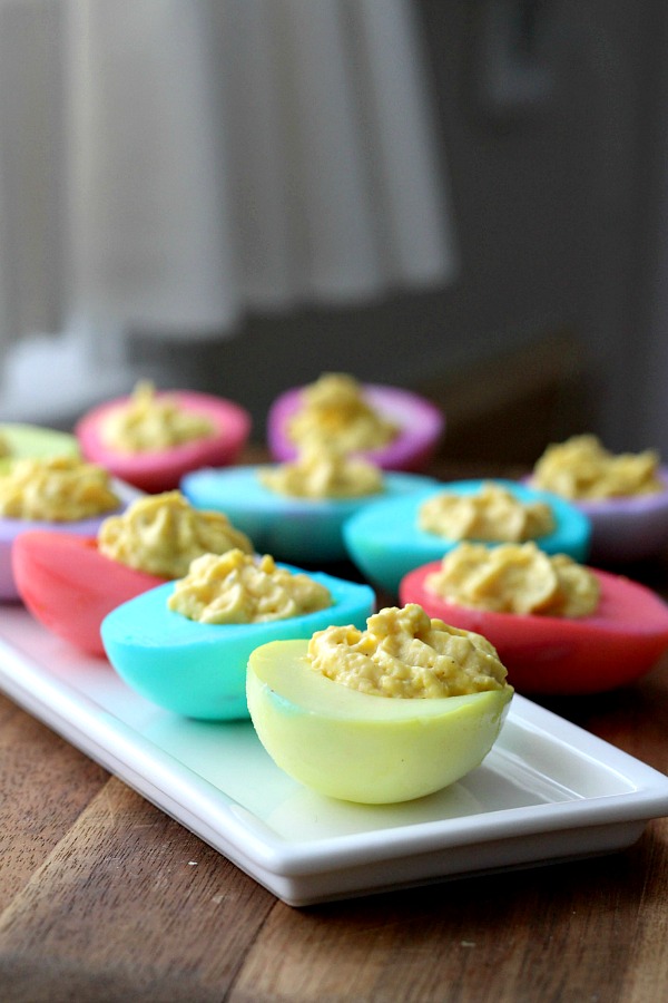 Bring springtime to your Easter table with a palate of soft pastel colored deviled eggs that are almost too pretty to eat. Instead of dying the egg shells, the cooked white part of the egg is colored then filled with the yolk mixture just like regular deviled eggs.