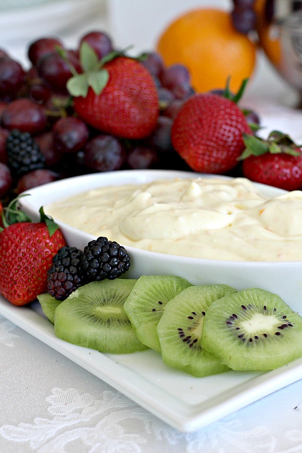 Super easy recipe for a delicious orange fruit dip made with cream cheese, orange zest, orange juice, cream and confectioners' sugar. It is the best!