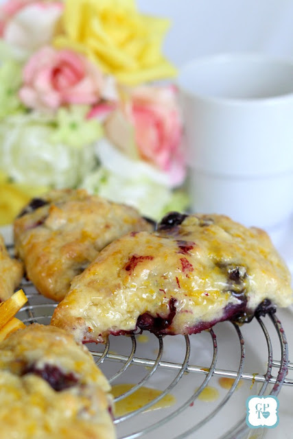 Delicious scones filled with blueberries with an orange or lemon glaze on top. Perfect for breakfast or at break time with your coffee or tea.