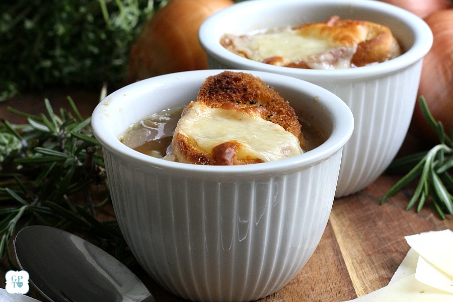 Easy recipe for French Onion soup in a rich beef broth with sweet caramelized onions and topped with toasted baguette and melty cheese. 