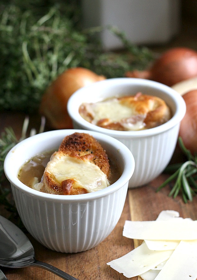 Easy recipe for French Onion soup in a rich beef broth with sweet caramelized onions and topped with toasted baguette and melty cheese. 