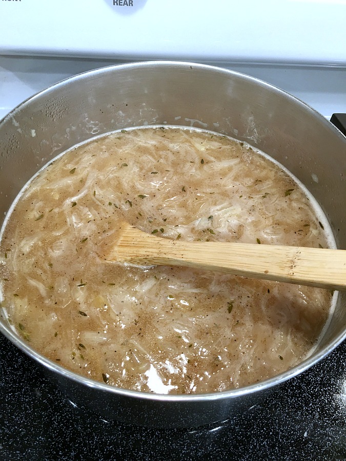 Easy recipe for French Onion soup in a rich beef broth with sweet caramelized onions and topped with toasted baguette and melty cheese. 