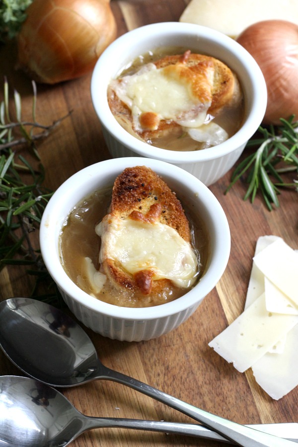 Easy recipe for French Onion soup in a rich beef broth with sweet caramelized onions and topped with toasted baguette and melty cheese. 