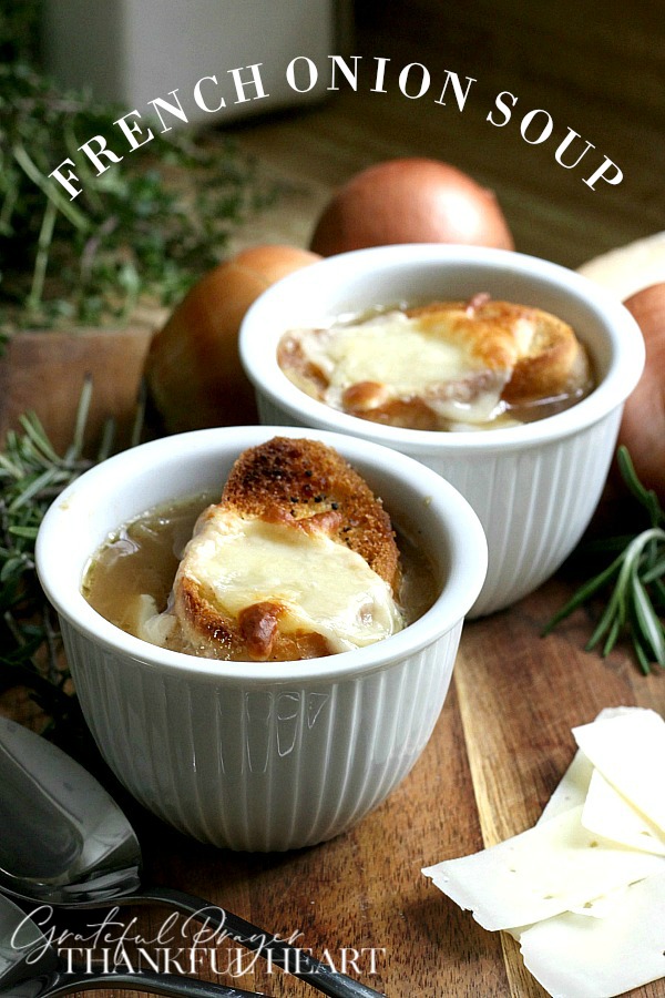 Easy recipe for French Onion soup in a rich beef broth with sweet caramelized onions and topped with toasted baguette and melty cheese. 