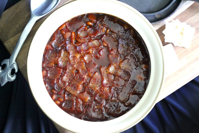 Homemade, old fashioned baked beans take a little time but so worth it! Tender navy or Lima beans in a brown sugar and molasses sauce is a perfect side. 