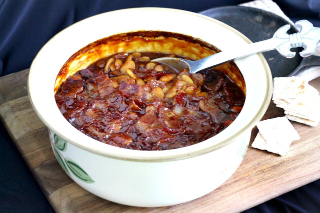 Homemade, old fashioned baked beans take a little time but so worth it! Tender navy or Lima beans in a brown sugar and molasses sauce is a perfect side. 