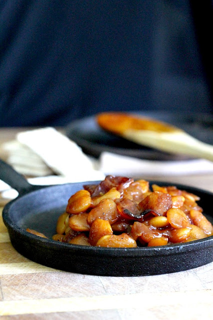 Homemade, old fashioned baked beans take a little time but so worth it! Tender navy or Lima beans in a brown sugar and molasses sauce is a perfect side. 