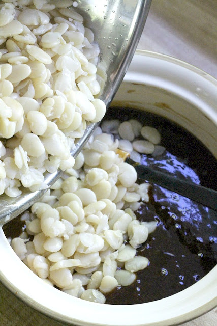 Homemade, old fashioned baked beans take a little time but so worth it! Tender navy or Lima beans in a brown sugar and molasses sauce is a perfect side. 