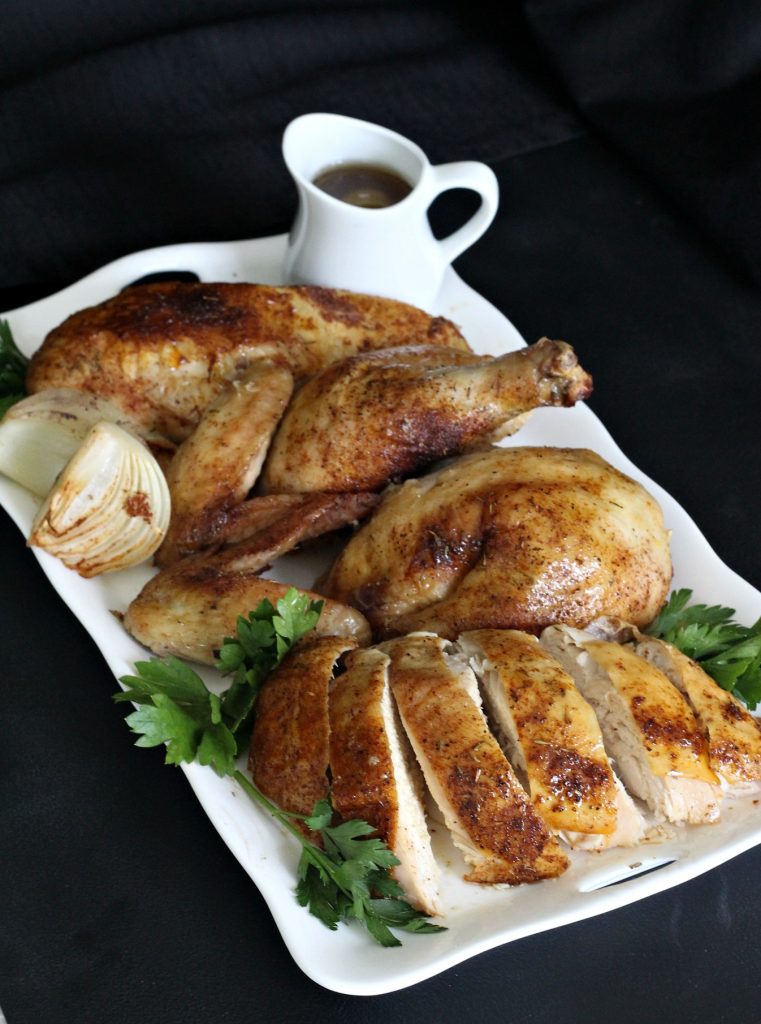 Easy recipe for moist and tender chicken, slow roasted in the oven with dry rub spices. 