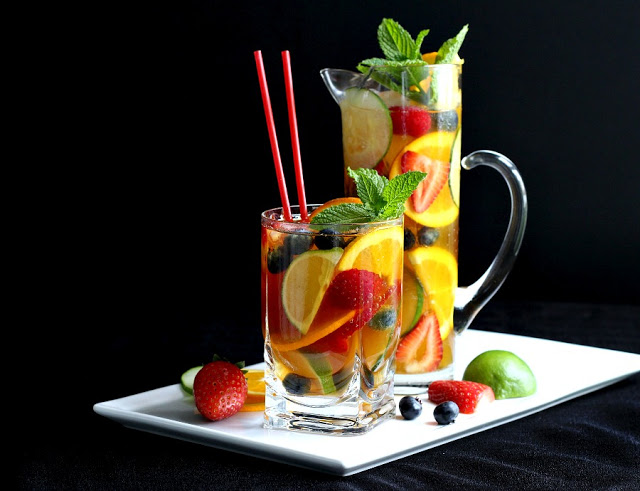 Easy recipe for a pitcher of the perfect Pimm's cup! Iconic cocktail from London we first enjoyed at the Sherlock Holmes Pub. Pimm's No 1 with cucumber, berries and Sparkling Lemonade or Ginger ale for a refreshing beverage. 