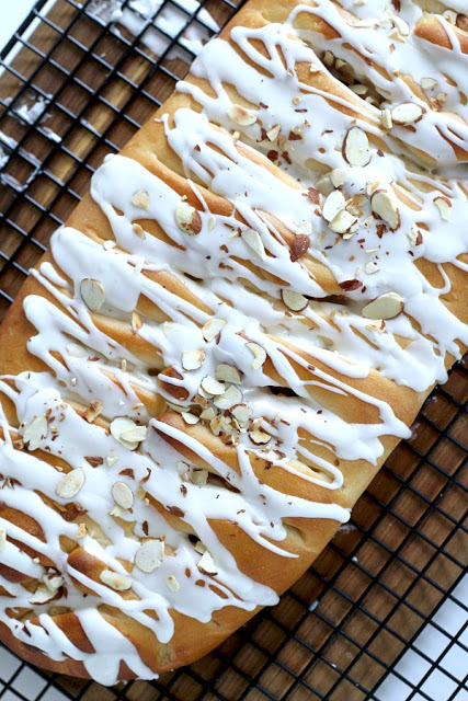 Frosted Apple Danish Braid made easy with dough from Bread Machine. Filled with cinnamon and apples and topped with frosting and toasted almonds. Breakfast or snack treat!