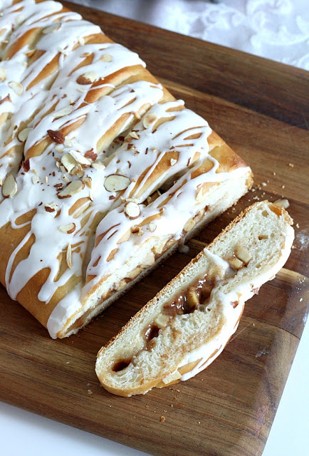 Frosted Apple Danish Braid made easy with dough from Bread Machine. Filled with cinnamon and apples and topped with frosting and toasted almonds. Breakfast or snack treat!