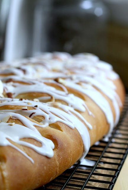 Frosted Apple Danish Braid made easy with dough from Bread Machine. Filled with cinnamon and apples and topped with frosting and toasted almonds. Breakfast or snack treat!