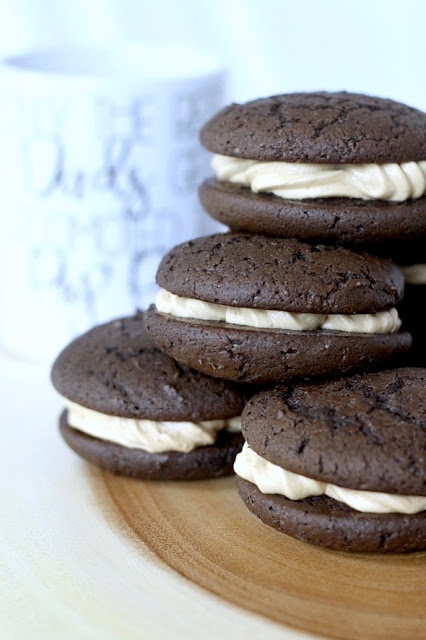 Chocolate Espresso Whoopie Pies are decadent and delicious. The dark chocolate cookie is rich and cake like. Or even brownie like, with a hint of coffee. Two cookies are sandwiched together with a frosting filling that is light and fluffy with more coffee flavor!