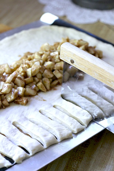 Frosted Apple Danish Braid made easy with dough from Bread Machine. Filled with cinnamon and apples and topped with frosting and toasted almonds. Breakfast or snack treat!