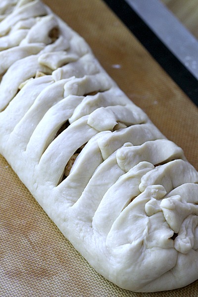 Frosted Apple Danish Braid made easy with dough from Bread Machine. Filled with cinnamon and apples and topped with frosting and toasted almonds. Breakfast or snack treat!