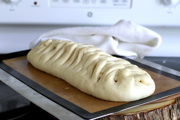 Frosted Apple Danish Braid made easy with dough from Bread Machine. Filled with cinnamon and apples and topped with frosting and toasted almonds. Breakfast or snack treat!