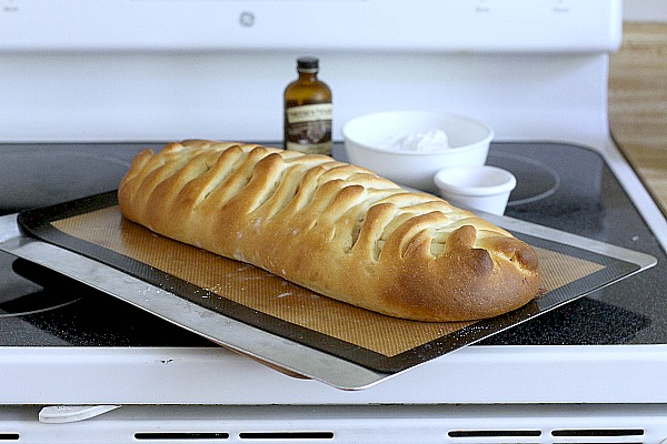 Frosted Apple Danish Braid made easy with dough from Bread Machine. Filled with cinnamon and apples and topped with frosting and toasted almonds. Breakfast or snack treat!