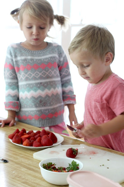 Strawberry Pie topped with whipped cream. Made this pie with two preschoolers for a fun and tasty baking-with-kids dessert.