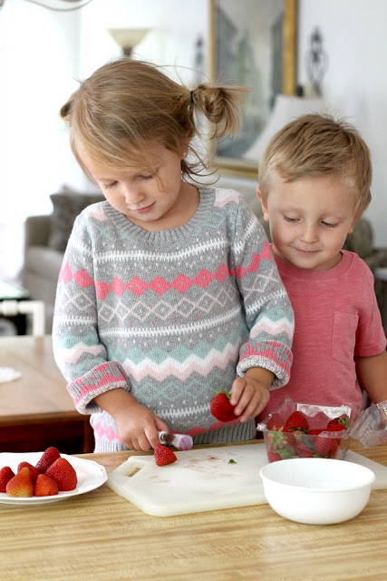 Strawberry Pie topped with whipped cream. Made this pie with two preschoolers for a fun and tasty baking-with-kids dessert.