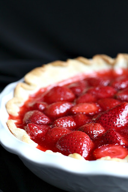 Strawberry Pie topped with whipped cream. Made this pie with two preschoolers for a fun and tasty baking-with-kids dessert.