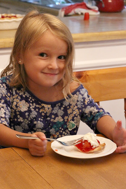 Strawberry Pie topped with whipped cream. Made this pie with two preschoolers for a fun and tasty baking-with-kids dessert.