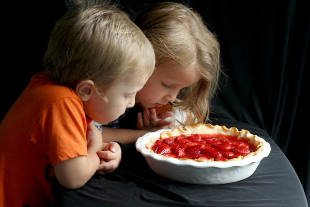 Strawberry Pie topped with whipped cream. Made this pie with two preschoolers for a fun and tasty baking-with-kids dessert.