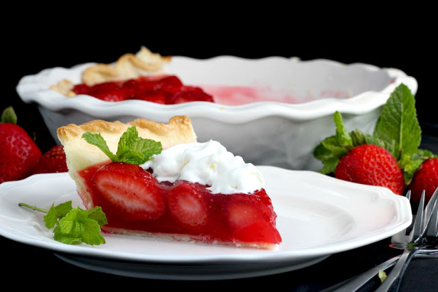 Strawberry Pie topped with whipped cream. Made this pie with two preschoolers for a fun and tasty baking-with-kids dessert.