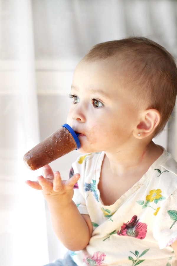 Enjoy an easy summertime recipe for homemade frozen chocolate peanut butter pudding pops for kids and adults alike.