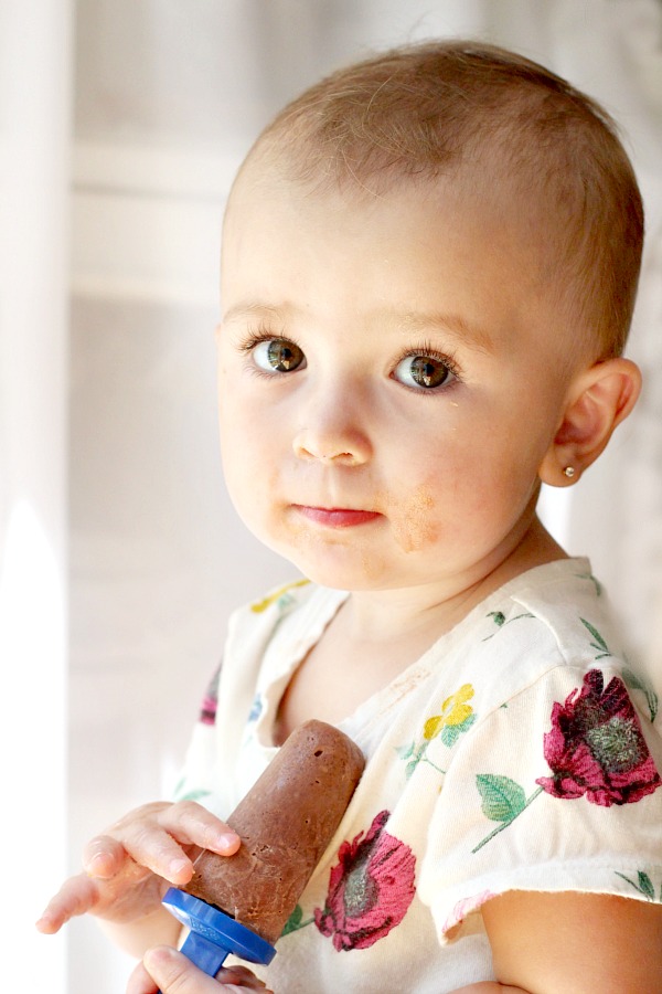 Joelle with frozen chocolate peanut butter pudding pop