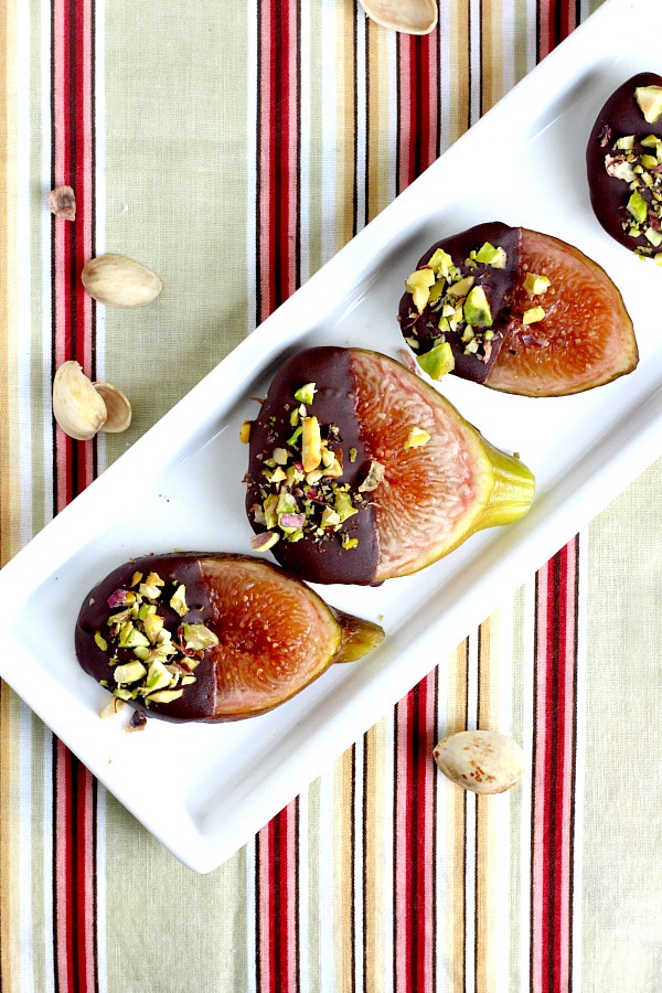 Easy and elegant sweet, after dinner dessert of fresh figs from backyard tree dipped in chocolate and topped with chopped pistachios.