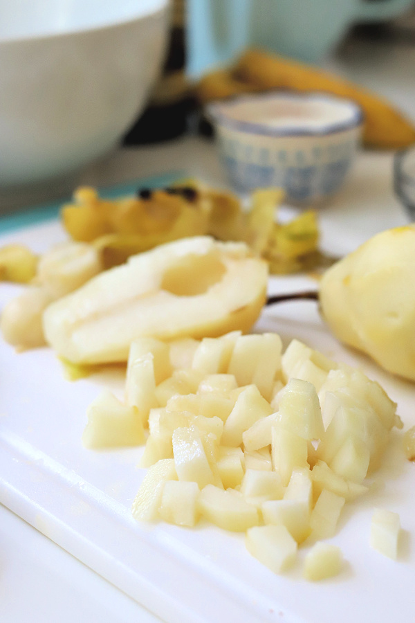 Chopping pears for pear, banana and walnut muffins