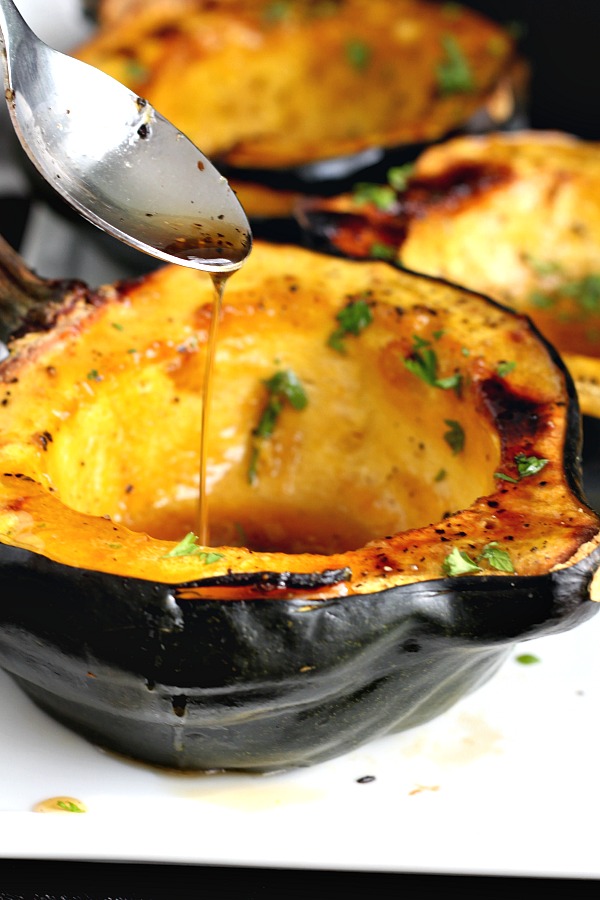 Baked acorn squash couldn't be easier. Bake the sliced and seeded squash with butter and maple syrup until fork tender. A lovely autumn side dish.