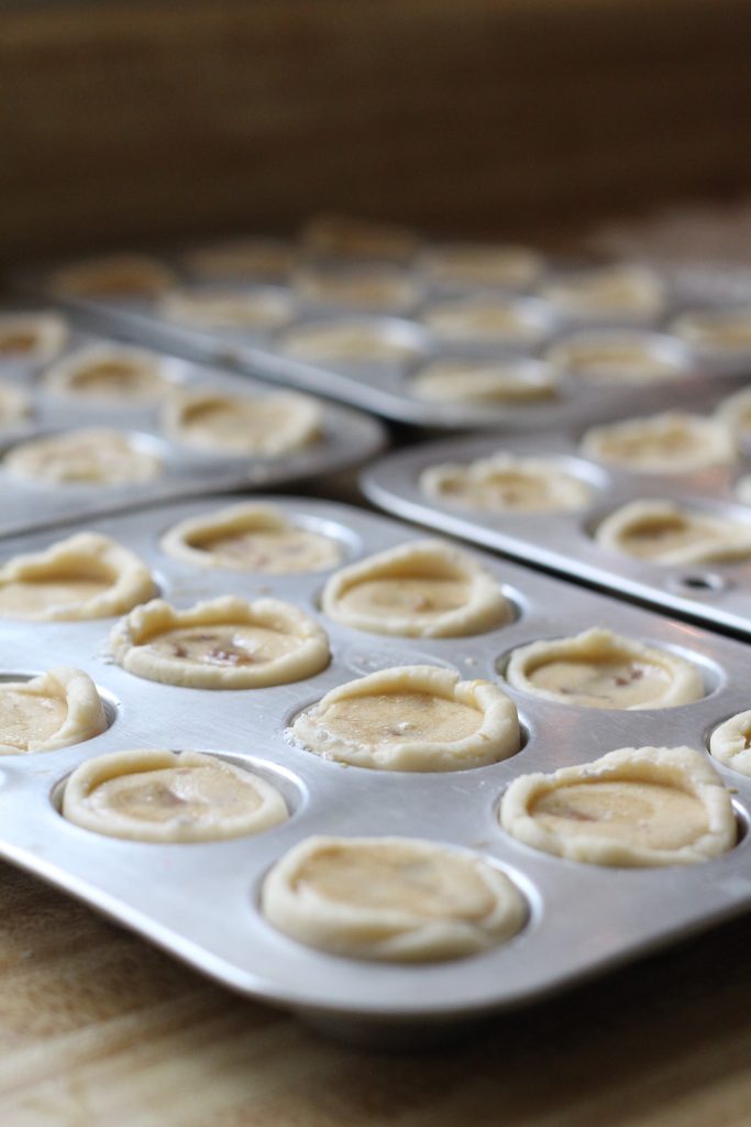 These sweet little tartlets called Pecan Tassies are like having scrumptious, bite-sized pecan pie. Sweet filling in a cream cheese pastry cup, they are also known as Nut Lassies.