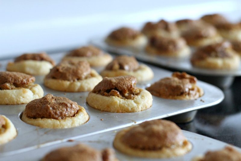 These sweet little tartlets called Pecan Tassies are like having scrumptious, bite-sized pecan pie. Sweet filling in a cream cheese pastry cup, they are also known as Nut Lassies.