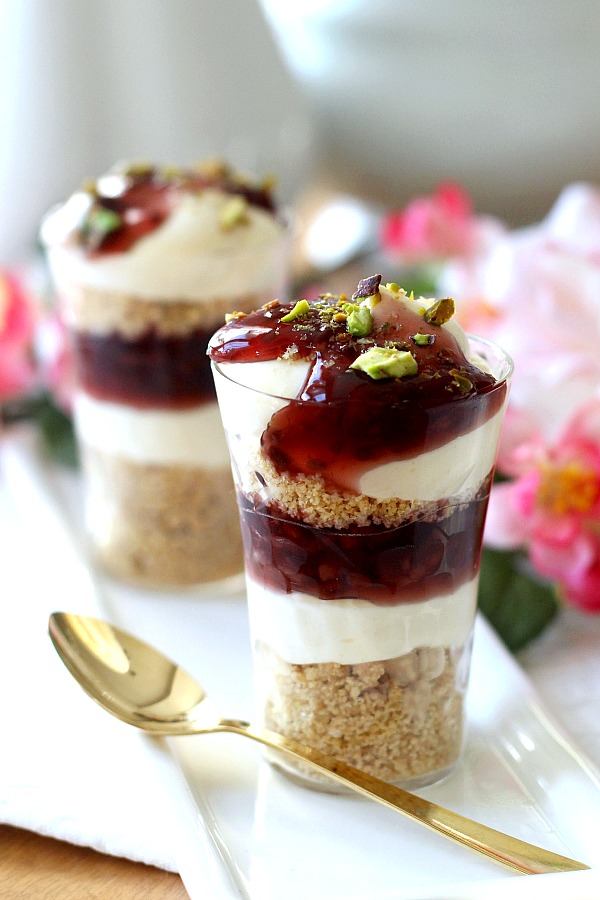 Easy No-Bake Raspberry and Pistachio Cheesecake Parfaits are so pretty and taste delicious. Make tiny, shot-size or fill you fanciest glasses. Change the fruit pie filling or use fresh fruit. It is up to you and it is all good!