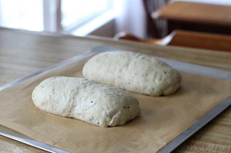 Cracked Pepper, Parmesan and Herbed Bread is full of flavor, slices beautifully and great for sandwiches or buttered and served with soup or salad. Easy recipe dough is made in a bread maker and shaped as desired. Allow to rise, bake and enjoy!