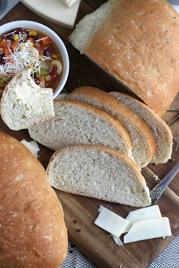 Parmesan, Cracked Pepper and Herbed Bread is full of flavor, slices beautifully and great for sandwiches or buttered and served with soup or salad. Easy recipe dough is made in a bread maker and shaped as desired. Allow to rise, bake and enjoy!