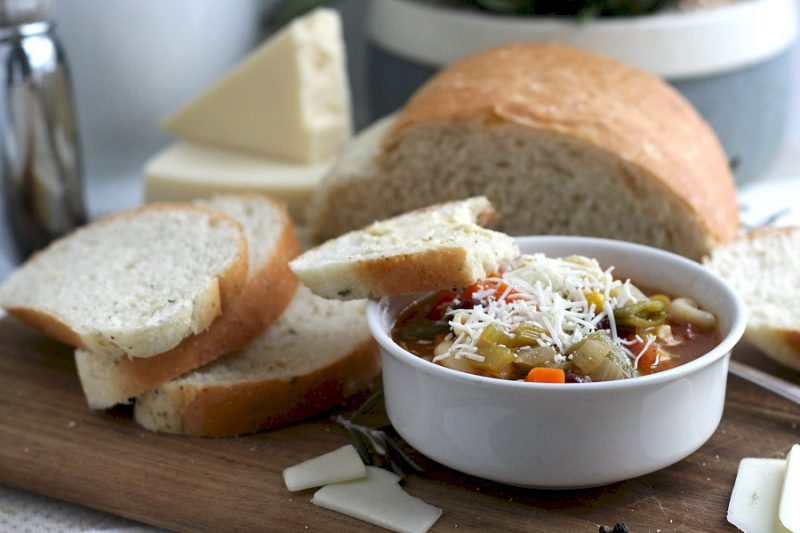 Parmesan, Cracked Pepper and Herbed Bread is full of flavor, slices beautifully and great for sandwiches or buttered and served with soup or salad. Easy recipe dough is made in a bread maker and shaped as desired. Allow to rise, bake and enjoy!