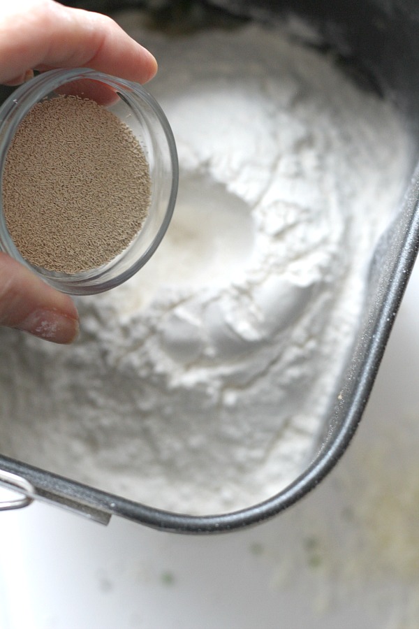 Cracked Pepper, Parmesan and Herbed Bread is full of flavor, slices beautifully and great for sandwiches or buttered and served with soup or salad. Easy recipe dough is made in a bread maker and shaped as desired. Allow to rise, bake and enjoy!