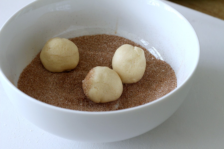 Easy recipe for classic Snickerdoodles. Buttery cookies rolled in cinnamon sugar and baked until edges are crisp and centers are soft. Delicious served with coffee or as an after school treat for kids with glasses of cold milk. 