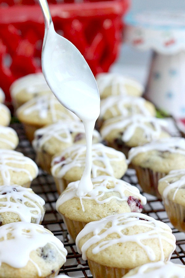 Both cherries and chocolate chips are folded into the batter of these delicious glazed Cherry Chocolate Chip Muffins. Perfect breakfast or snacking treat.