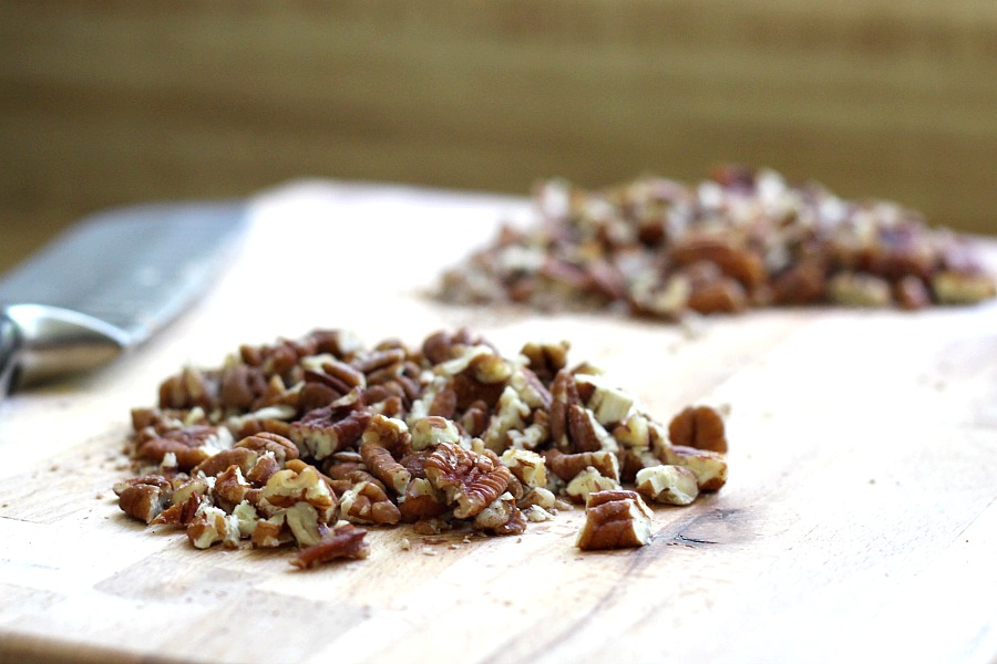 Easy recipe for frosted applesauce bread full of warm flavors of cinnamon, allspice & nutmeg. You don't even need a mixer to make this delicious quick bread.